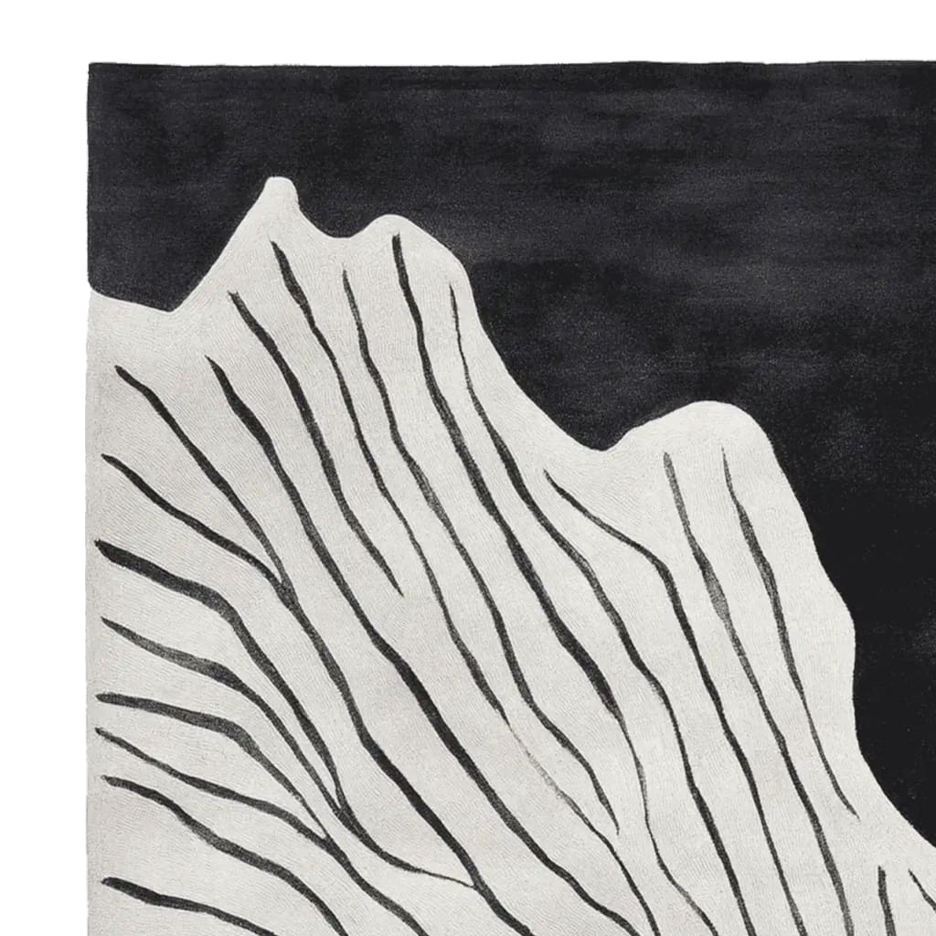 Close-up view of the Black White Rhythm Hand Tufted Area Rug, showcasing its contemporary abstract design with flowing black lines on a white background. Perfect for adding a modern touch to living room area rugs, this wool rug offers both style and comfort.