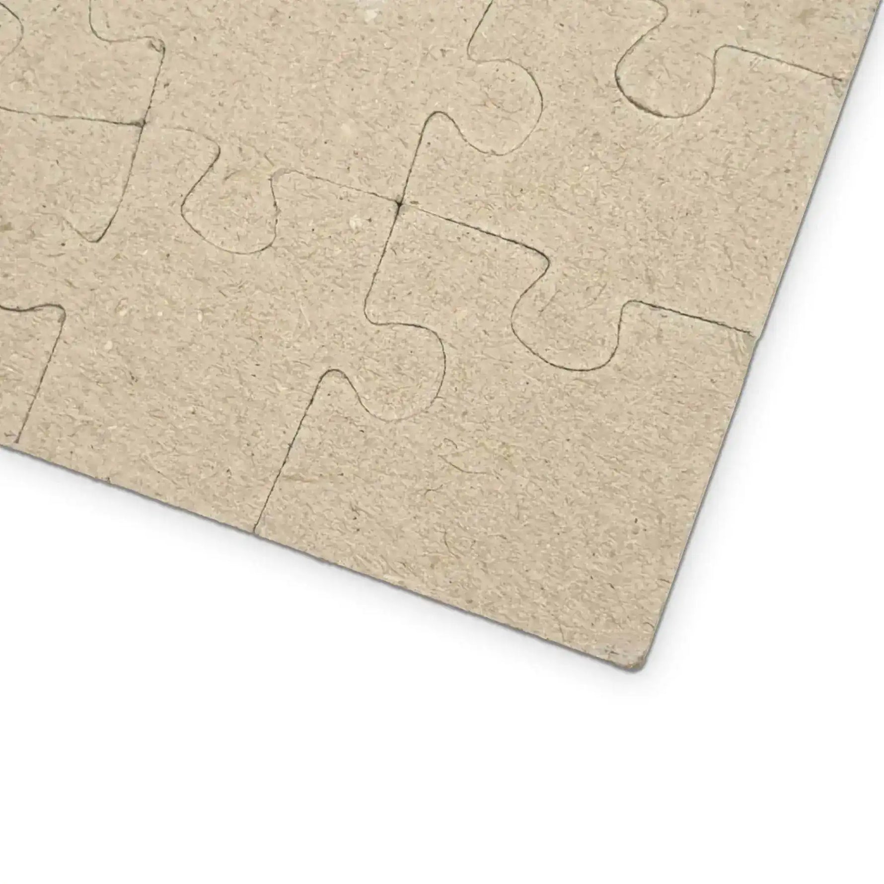 Blank textured cardboard back of an assembled Urban Vibes puzzle, beige kraft pieces on white
