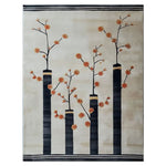 A stunning hand-tufted wool area rug featuring an elegant abstract design with tall black columns adorned with orange floral branches against a soft beige background. The intricate pattern adds a modern, artistic touch to any space.