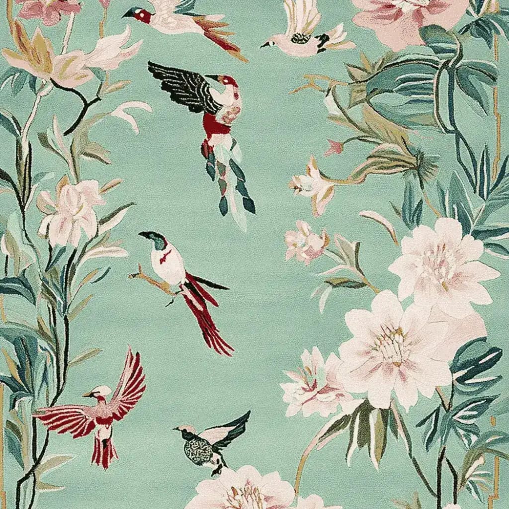 Intricately designed Bloom and Breeze Hand Tufted Area Rug featuring vibrant birds and lush floral patterns, perfect for adding a touch of elegance to your living room. This wool rug showcases a harmonious blend of colors and nature-inspired elements, making it an ideal choice for living room rugs 8x10.