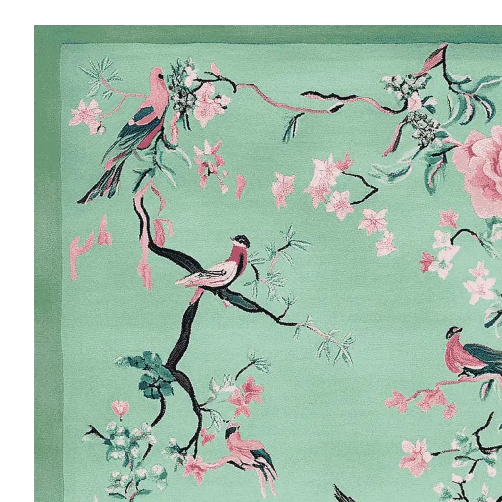 This vibrant Bloom and Breeze Hand Tufted Area Rug showcases an exquisite design with birds perched on branches surrounded by pink blossoms on a soft green background. Perfect for enhancing the aesthetic appeal of your living room, this wool rug is an ideal choice for those seeking elegant living room rugs 8x10.