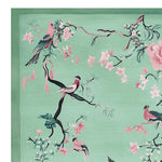 This vibrant Bloom and Breeze Hand Tufted Area Rug showcases an exquisite design with birds perched on branches surrounded by pink blossoms on a soft green background. Perfect for enhancing the aesthetic appeal of your living room, this wool rug is an ideal choice for those seeking elegant living room rugs 8x10.