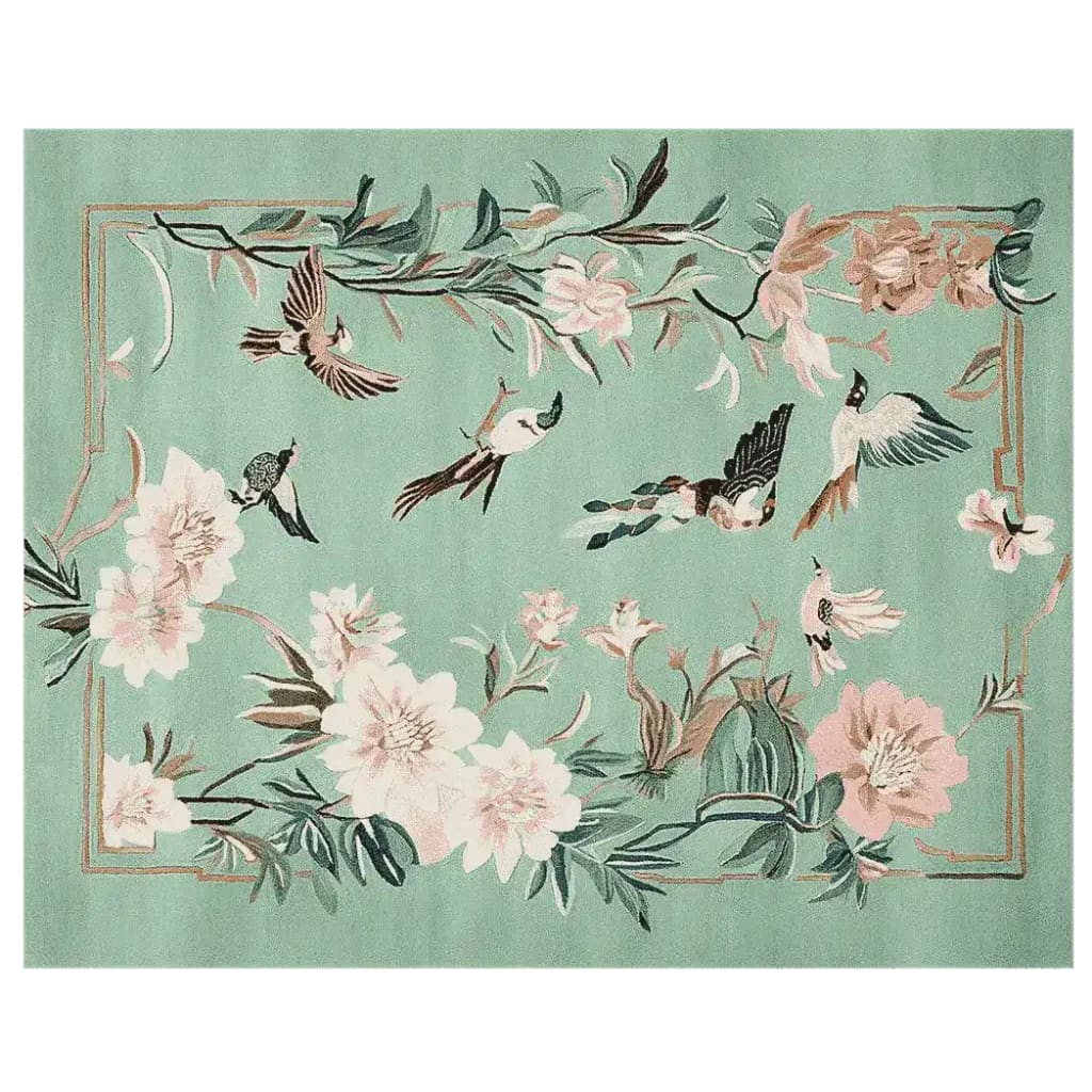 This exquisite area rug features a hand-tufted design with a serene teal background, adorned with delicate floral motifs and fluttering birds. Perfectly sized for living rooms, this 8x10 wool rug brings a touch of nature indoors, creating a tranquil and inviting atmosphere.