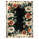 This beautiful Bloom Border Hand Tufted Rug showcases a vibrant floral design, perfect for enhancing living room decor. The area rug features lush blooms in earthy tones set against a dark background, making it an ideal wool rug choice for those seeking elegant floral rugs to complement their living space.