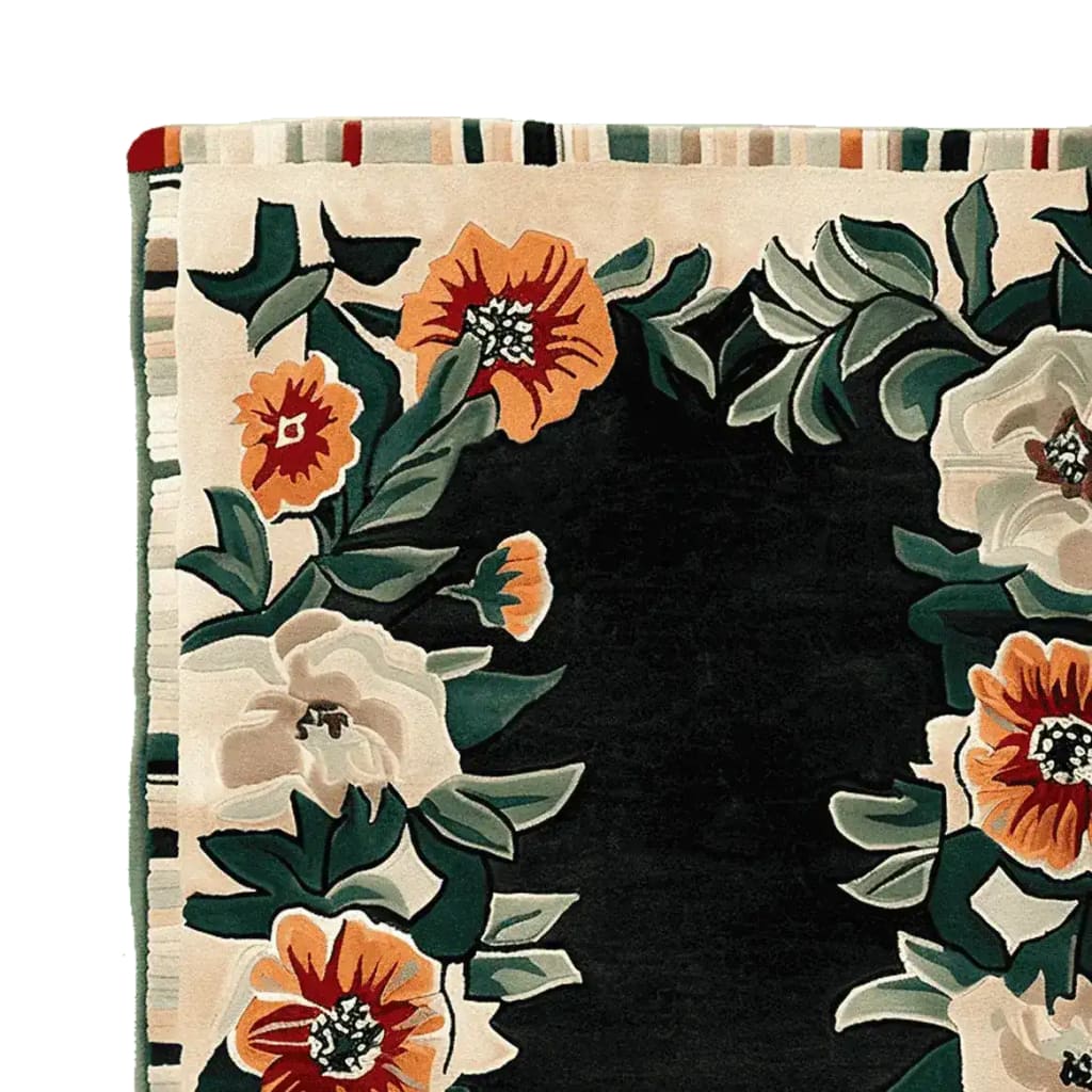 Close-up view of the Bloom Border Hand Tufted Rug, featuring vibrant floral patterns with orange and white blossoms on a dark background. This wool area rug adds a touch of elegance to living room spaces, perfect for those seeking stylish area rugs for their home decor.