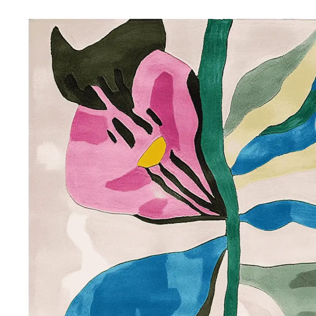 Close-up view of the Bloom Shape Dreams Hand Tufted Area Rug, featuring a vibrant abstract floral design in pink, blue, and green hues. This contemporary rug, perfect for living rooms, is crafted from high-quality wool and fits an 8x10 space seamlessly.