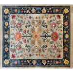 A beautifully designed Blooming Arbor Hand Knotted Area Rug featuring intricate floral patterns in vibrant colors, ideal for bringing a vintage touch to your bedroom or living room decor. This Persian-style rug measures 8x10, making it perfect for any space looking for a classic floral rug style.