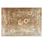Top view of the Blooming Grace Knotted Wool Area Rug, featuring an elegant floral design with soft pink and beige flowers on a muted background.