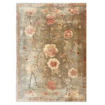 Top view of the Blooming Grace Knotted Wool Rug featuring a beautiful floral design in soft pinks and creams against a neutral gray background. The intricate detailing and elegant patterns make this area rug a stunning centerpiece for any room.