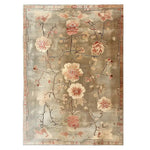 Top view of the Blooming Grace Knotted Wool Rug featuring a beautiful floral design in soft pinks and creams against a neutral gray background. The intricate detailing and elegant patterns make this area rug a stunning centerpiece for any room.