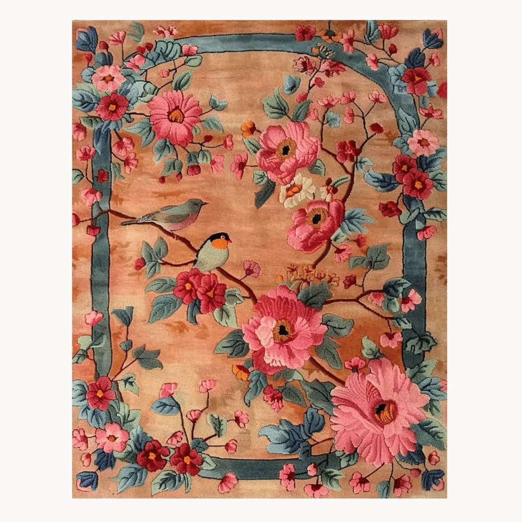 A beautifully crafted Blooming Symphony Hand Tufted Rug showcasing a vibrant floral design with birds, perfect for adding elegance to any living room. This wool area rug features pink and blue flowers on a beige background, ideal for those seeking living room area rugs that stand out.