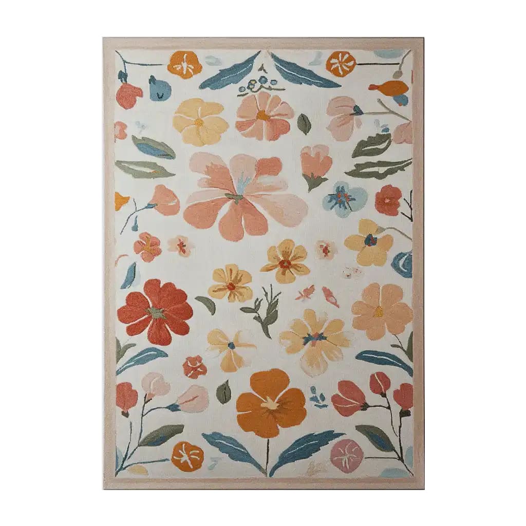 Top view of the Blooming Vortex Hand Tufted Wool Area Rug featuring a vibrant floral pattern with colorful flowers in shades of orange, yellow, and blue on a light background.