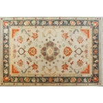 A beautifully hand-knotted area rug featuring a vibrant floral design, perfect for adding elegance to any living room. This Persian-inspired rug showcases intricate patterns with rich colors, making it an ideal choice for those seeking a floral rug with traditional charm.