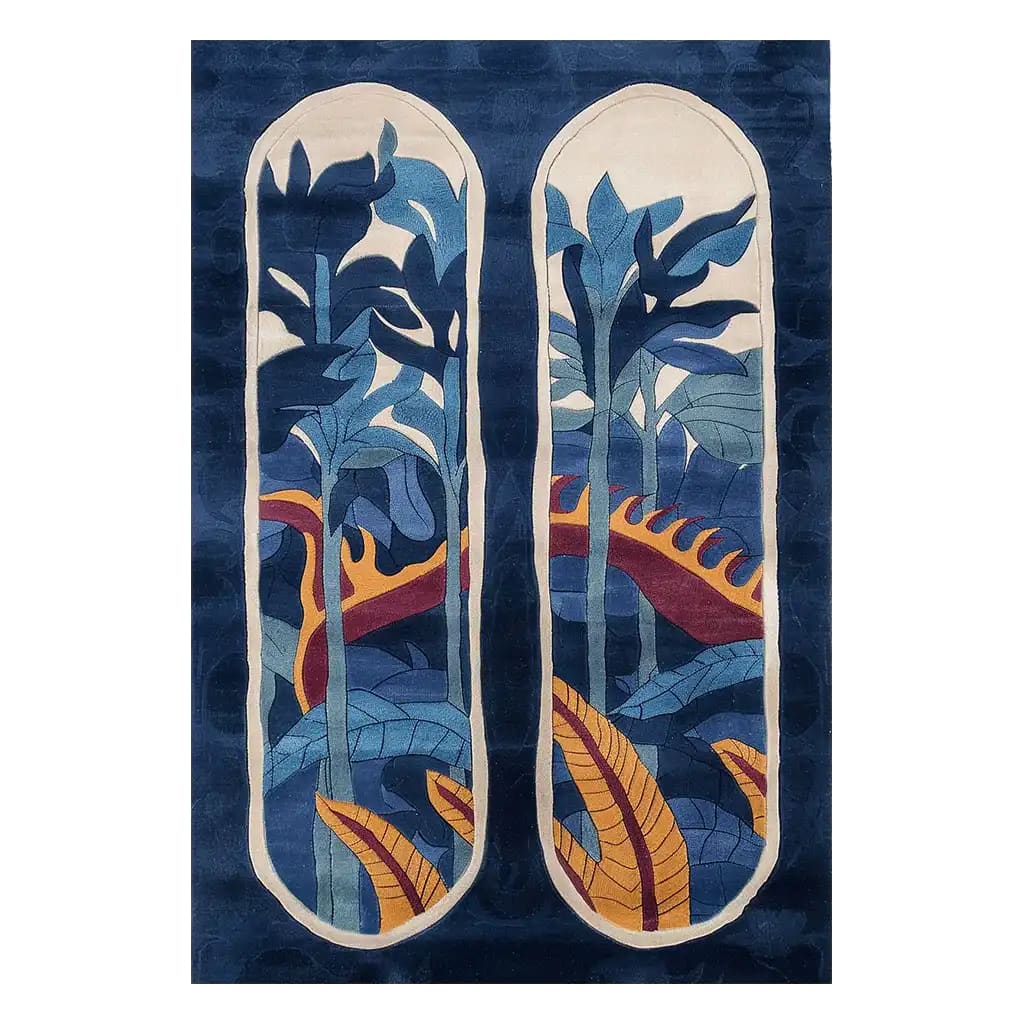 The Blossom Canopy Hand Tufted Wool Rug features an abstract design with vibrant blue and orange foliage against a deep blue background, creating a striking visual appeal. Perfect as an area rug for adding a touch of nature-inspired elegance to any room.