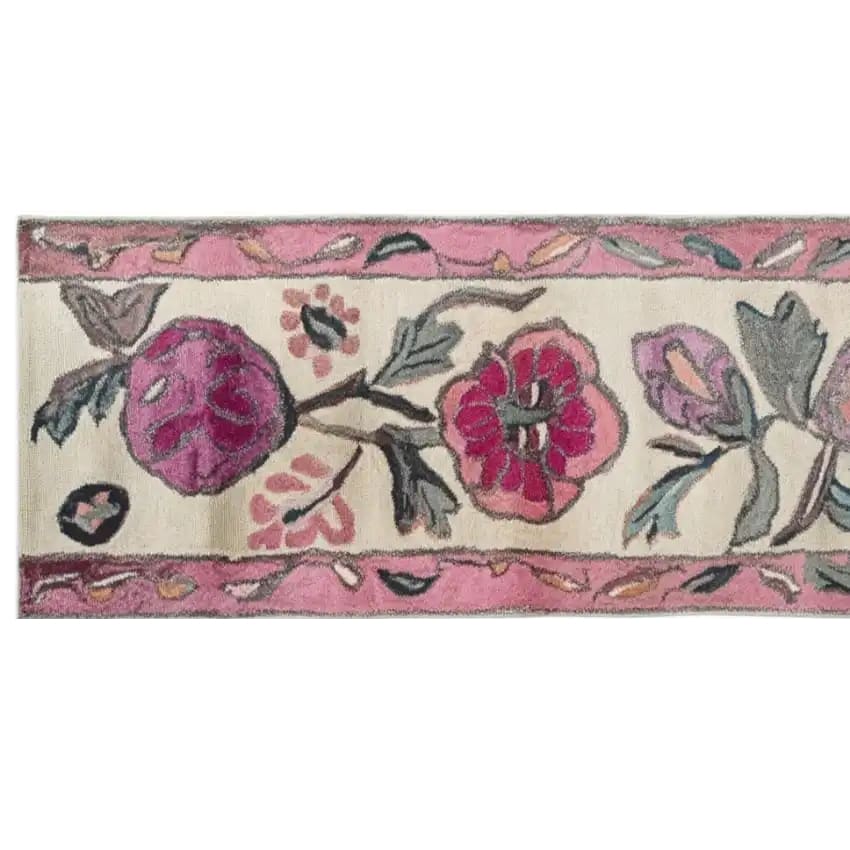 Top view of the Blossom Cascade Hand Tufted Wool Rug, featuring vibrant floral patterns in shades of pink and purple on a cream background. Perfect for use as a runner rug in kitchens, hallways, or bathrooms, this wool rug adds a touch of elegance and warmth.