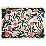 A vibrant hand-tufted wool area rug featuring a lively floral design with pink, orange, and dark green hues. The rug displays an intricate pattern of blossoming flowers and leaves, adding a touch of nature-inspired elegance to any room.