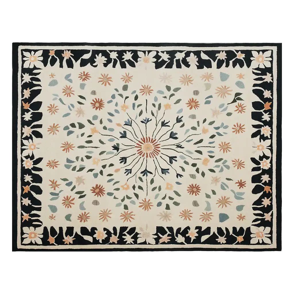 Top view of the Blossom Frame Hand Tufted Wool Area Rug, featuring an intricate floral pattern with a central blossom design surrounded by colorful leaves and flowers. The rug's border is adorned with a black background and floral motifs, creating a harmonious blend of elegance and warmth.