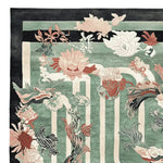 A beautifully designed hand-tufted area rug featuring a vibrant floral pattern with shades of green, pink, and white. This wool rug is perfect for adding a touch of elegance to living room area rugs, making it an ideal choice for those seeking stylish rugs for living room spaces.