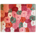A vibrant Blossom Mosaic Hand Tufted Wool Area Rug featuring an abstract floral pattern in shades of pink, red, orange, and green. The design showcases a harmonious blend of colors, creating a lively and artistic appearance perfect for enhancing any living space.