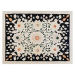Top view of the Blossom Radiance Hand Tufted Wool Area Rug featuring intricate floral designs in soft pastel shades set against a dark border, creating a striking contrast.