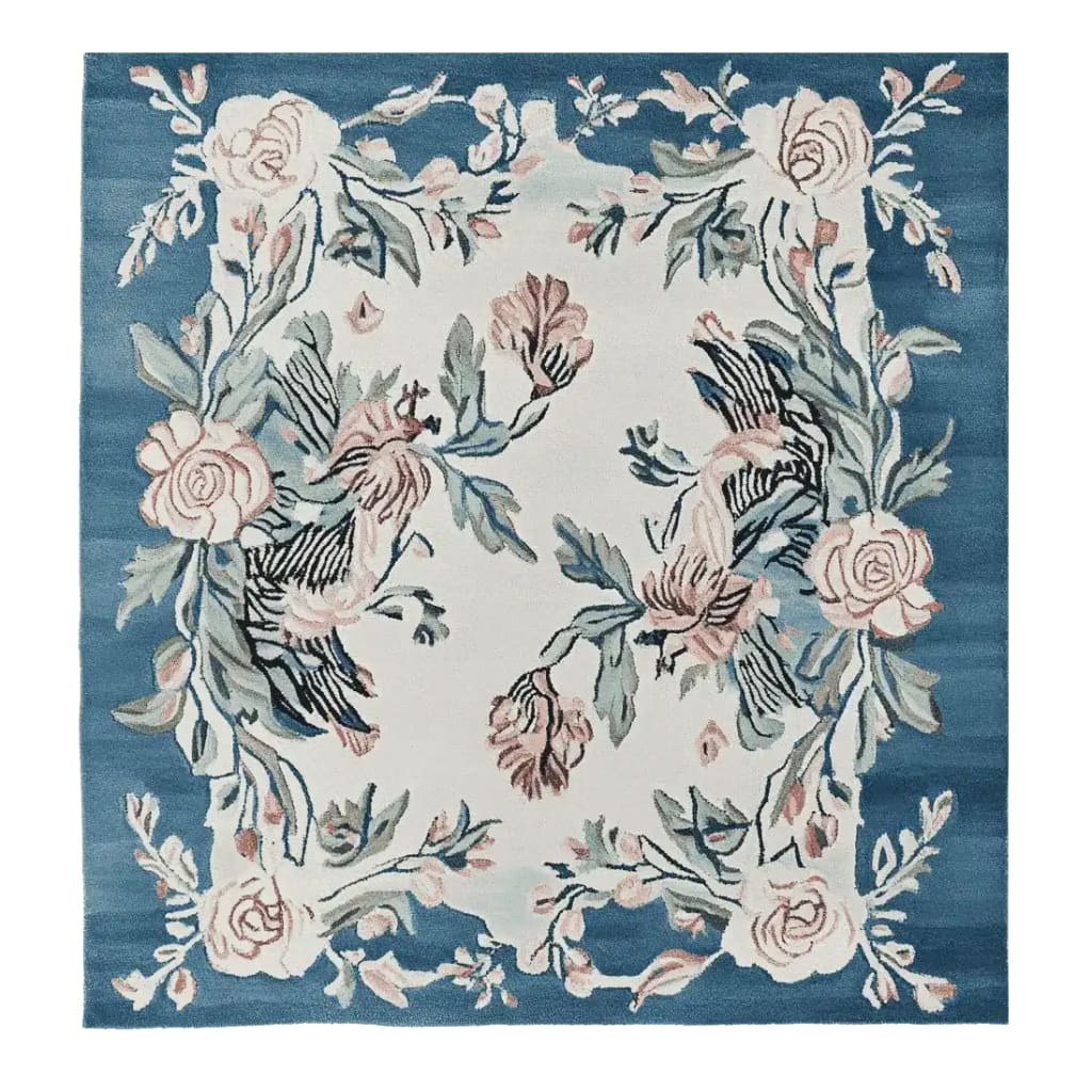 The Blossom Serenade Tapestry Hand Tufted Rug is a stunning square area rug perfect for adding elegance to your living room. This wool rug features a beautiful floral design with intricate blossoms and leaves in soft pink and green hues on a rich blue background. Ideal for those seeking rugs for living room spaces, this 8x10 square rug offers a luxurious touch and a cozy feel.