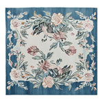 The Blossom Serenade Tapestry Hand Tufted Rug features a striking floral design with pink and peach blossoms on a woolen surface. This square area rug is perfect for adding elegance to any living room. The blue and white color scheme enhances the floral patterns, making it an ideal choice for those seeking stylish rugs for living rooms. Its size, resembling an 8x10 layout, makes it a versatile addition to any space.