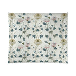 Cream comforter with a delicate pink and blue lotus floral print, flat view