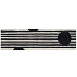 Top view of a contemporary runner rug made from hand-tufted wool, featuring bold black and white stripes with circular accents. Perfect as a kitchen rug, hallway runner rug, or bathroom runner rug.