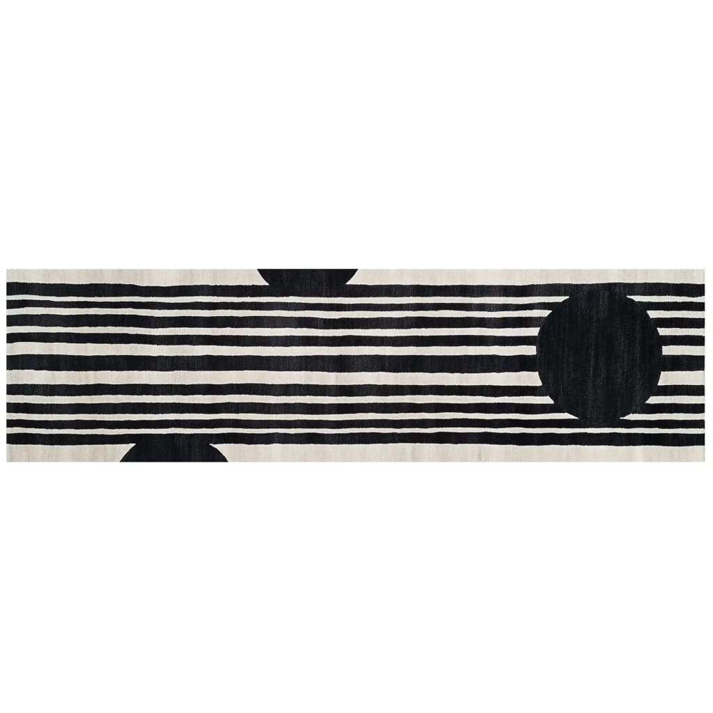 Top view of a contemporary runner rug made from hand-tufted wool, featuring bold black and white stripes with circular accents. Perfect as a kitchen rug, hallway runner rug, or bathroom runner rug.