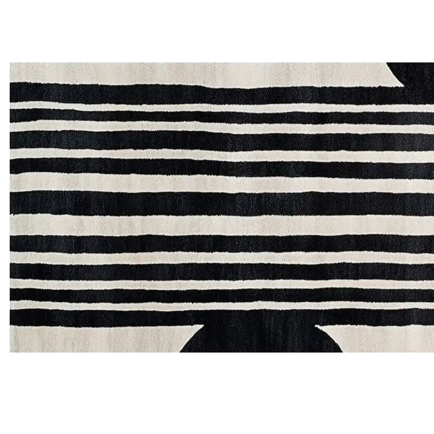 Top view of the Blossom Symphony Hand Tufted Wool Rug, showcasing a stylish black and white striped pattern. This contemporary runner rug is perfect for adding elegance to any hallway, kitchen, or bathroom space.