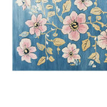 A beautifully designed area rug featuring a vibrant floral pattern with pink blossoms and golden leaves on a rich blue background. The Blossom Vine Tapestry Hand Tufted Wool Rug adds a touch of elegance and warmth to any room.