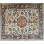 Blossom Vista Hand Knotted Area Rug showcasing intricate floral patterns and a central medallion design, perfect for adding a touch of elegance to your living room. This vintage Persian-style rug features a rich color palette with detailed craftsmanship, ideal for those seeking a classic floral rug.