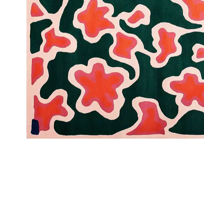 Top view of the Blossoming Garden Harmony Hand Tufted Wool Rug, featuring vibrant abstract floral patterns in bold red and green tones. This area rug adds a touch of elegance and warmth, perfect for modern home decor.