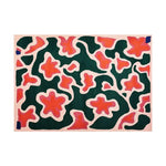 Top view of the Blossoming Garden Harmony Hand Tufted Wool Area Rug featuring abstract floral patterns in vibrant green and coral hues, creating a lively and artistic centerpiece for any room.