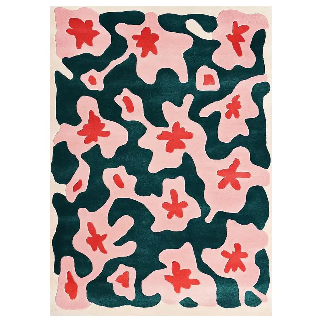 Vibrant Blossoming Teal Hand Tufted Wool Rug featuring an abstract floral design with bold red and soft pink shapes against a deep teal background. This eye-catching area rug adds a splash of color and style to any room.