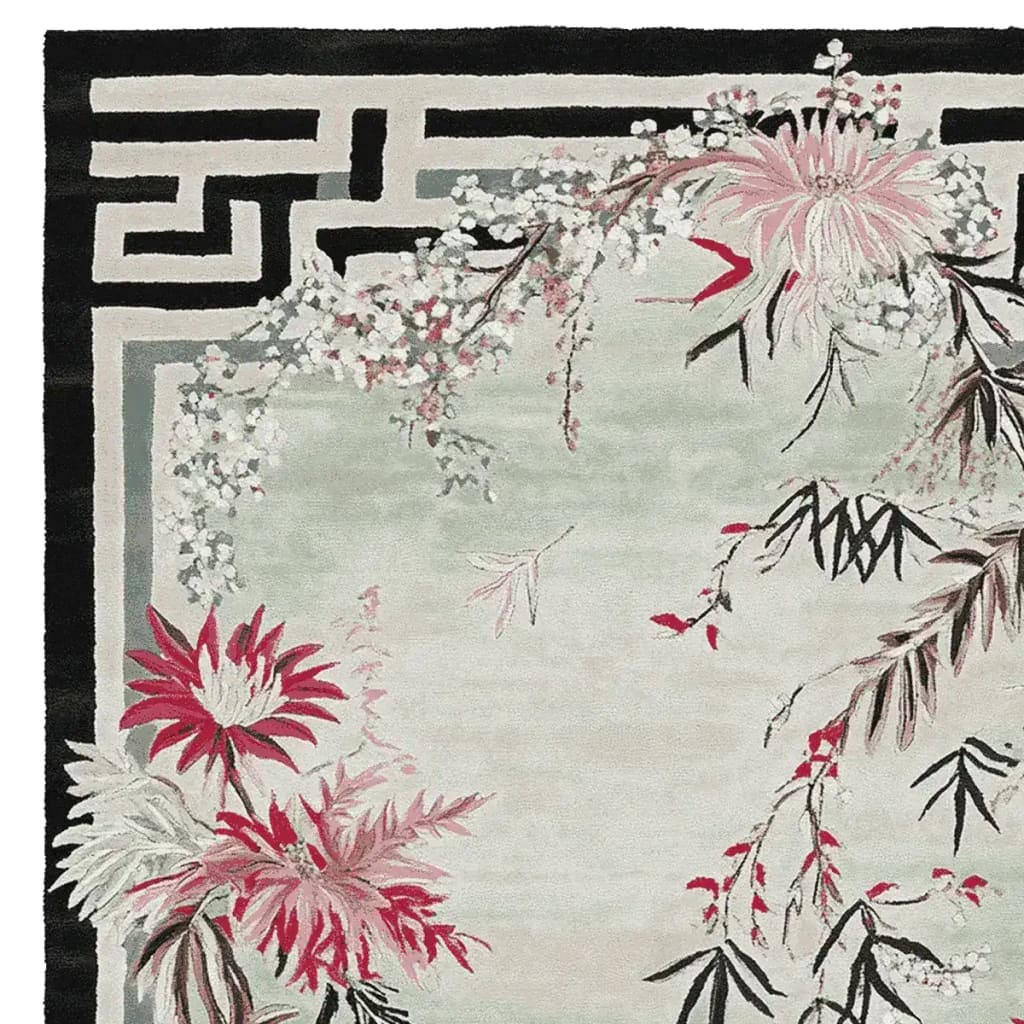 A beautifully designed area rug featuring a hand-tufted floral pattern with blossoms in pink and red hues, against a soft green backdrop. This wool rug adds an elegant touch to living room spaces, perfect for those seeking area rugs for living room or living room rugs 8x10.
