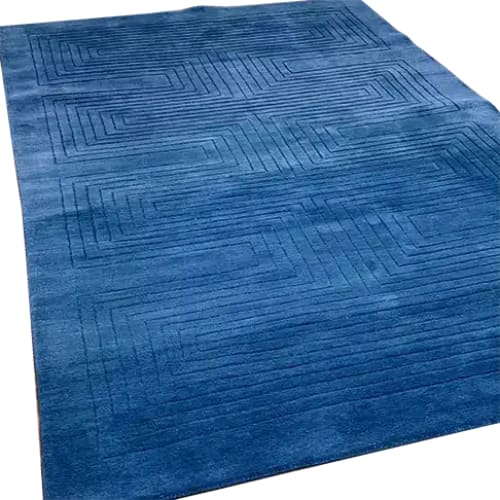 A stylish Blue Arctic Geo Modern Hand Tufted Wool Area Rug measuring 8 x 10 ft. Perfect for adding a contemporary touch to living rooms and dining rooms, this rug features a geometric pattern that enhances any space. Ideal as a focal point in your living room or as a sophisticated dining room area rug, its wool construction ensures durability and comfort.