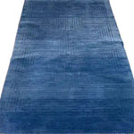 Explore the Blue Arctic Geo Modern Hand Tufted Wool Rug, an elegant 8 x 10 ft area rug perfect for enhancing your living room or dining room. This plush wool rug features a sophisticated geometric pattern, offering both comfort and style as a centerpiece for your space.