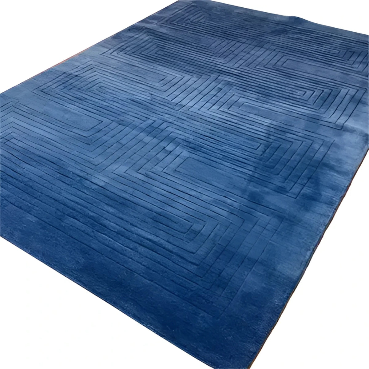 Top view of the Blue Arctic Geo Modern Hand Tufted Wool Rug, perfect for a living room or dining room. This luxurious 8 x 10 ft area rug features a geometric pattern that adds a contemporary touch to any space, making it an ideal choice for those seeking high-quality wool rugs for living room or dining room area rugs.