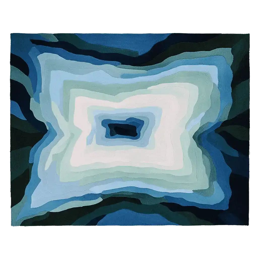 A striking Blue Depth Vortex hand-tufted area rug featuring an abstract design with layers of blues and whites, perfect for contemporary living rooms. This wool rug adds a modern touch to any space, making it an ideal choice for living room area rugs or rugs for living room spaces.