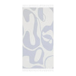 Reverse side of blue flow abstract beach towel in pale lavender and white fluid pattern, portrait flat lay with fringe ends