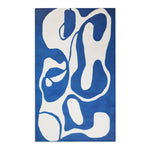 Vivid royal blue abstract modern rug with large white curvilinear shapes, no border visible