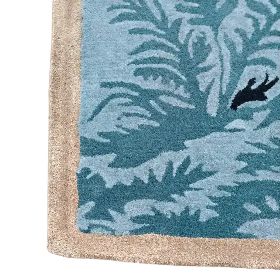 Close-up view of the Blue Peacock Floral Hand Tufted Area Rug, featuring intricate blue and beige patterns perfect for enhancing bedroom decor. Ideal for those seeking quality bedroom area rugs made from wool.