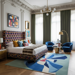 Luxurious bedroom with colorful headboard, patterned rug, and modern decor.