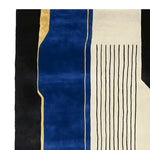 Contemporary wool area rug featuring a bold abstract design with deep blue and black panels, accented by gold and white lines. Perfect for enhancing large living rooms, this hand tufted rug adds a modern touch to any space.