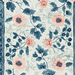 A beautifully detailed hand tufted area rug featuring a vibrant floral design with pink and blue blooms. This wool rug is perfect for adding elegance to any living room setting.