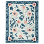 Elegant Blush Garden Bloom Hand Tufted Area Rug featuring a vibrant floral design with pink and blue flowers, perfect for adding a touch of nature to your living room. This wool rug combines style and comfort, ideal for those seeking a luxurious floral rug.