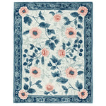 Elegant Blush Garden Bloom Hand Tufted Area Rug featuring a vibrant floral design with pink and blue flowers, perfect for adding a touch of nature to your living room. This wool rug combines style and comfort, ideal for those seeking a luxurious floral rug.