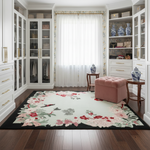 Decorative floral rug on a wooden floor with white walls and glass cabinet.
