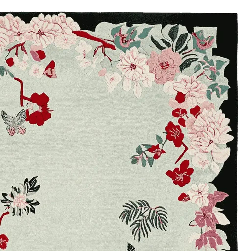 The Blush Meadow Charm Hand Tufted Rug is an elegant area rug perfect for large living rooms. Its woolen texture features a beautiful floral design in shades of pink, red, and green, making it an ideal choice for those seeking stylish area rugs for living rooms.